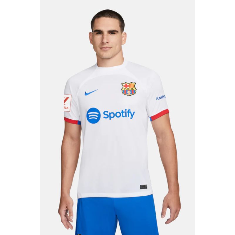Man wearing Lamine Yamal FC Barcelona away Nike jersey 23/24 with white and blue color scheme